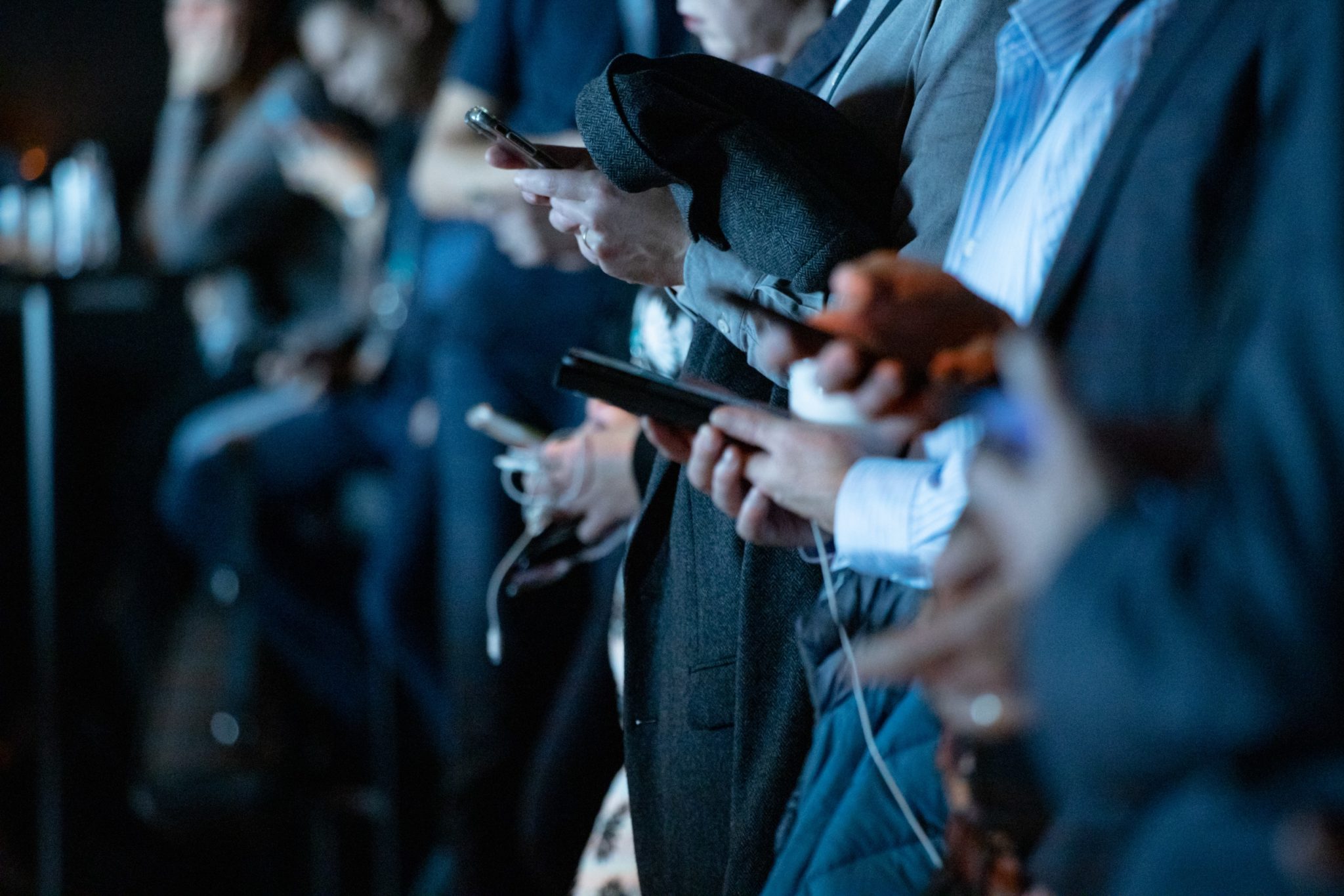 People staring at their smartphones
